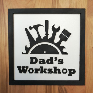 Dad's Workshop Wall Sign for Father's Day Gifts. Black and White frame with tool motif reads "Dad's Workshop"