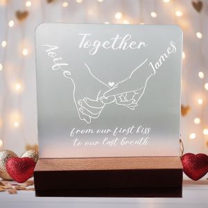 frosted acrylic plaque, twoo hand with pinky promise. white engraving. together text and the couple name. nice handmade wood base.